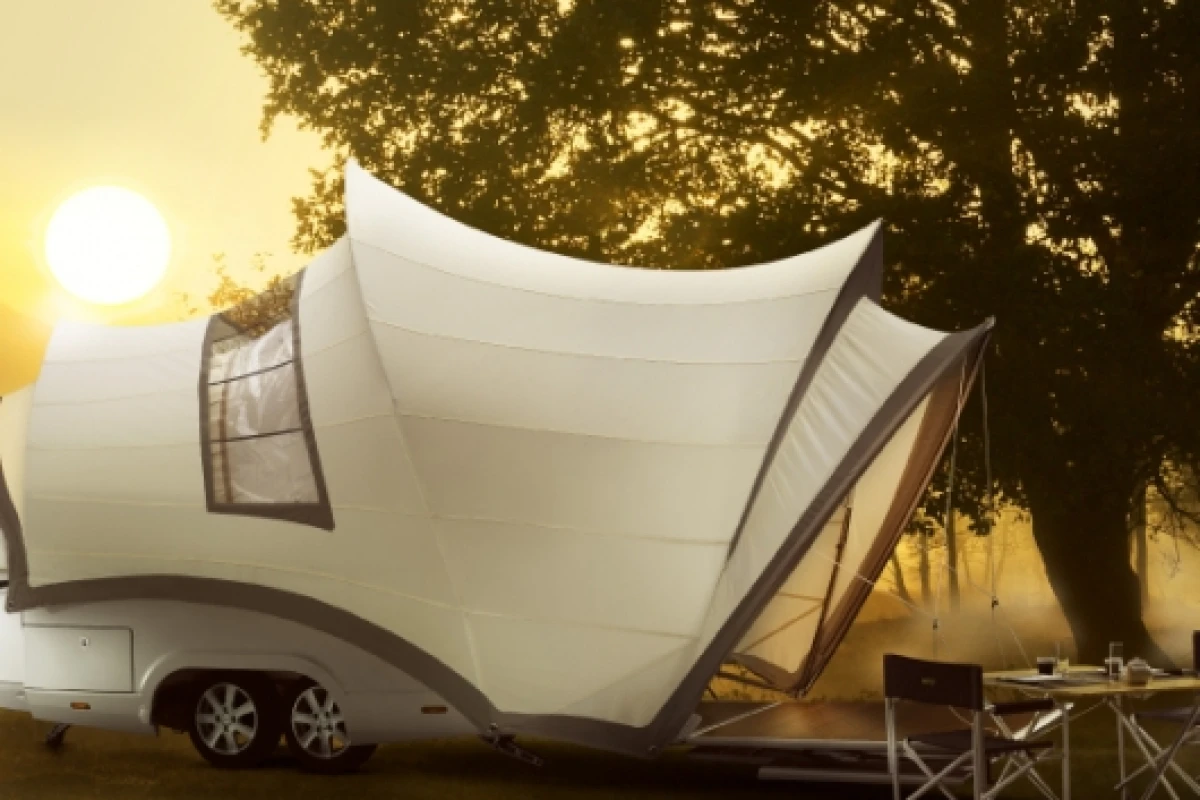 The Opera camper trailer has every conceivable luxury: electrically-adjustable beds, hot and cold water, ceramic toilet, LED lighting and a mobile hob and barbecue for cooking outside