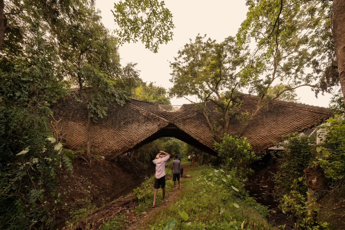 The Bridge House has been built across a 7-m gorge in rural India, using steel and mud with a pangolin-inspired roof