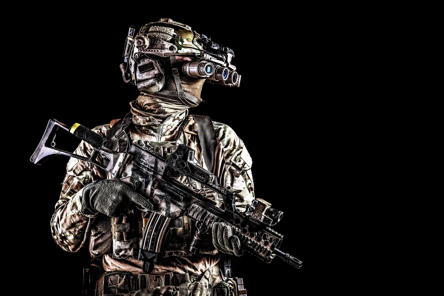A soldier wearing top of the line, ultra tacti-cool night-vision goggles