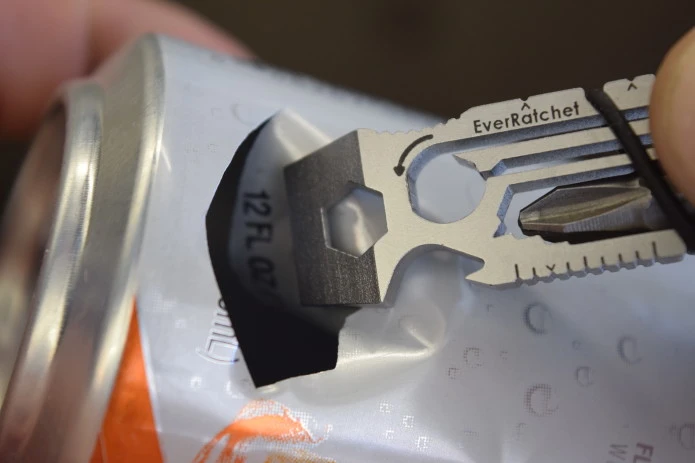 The EverRatchet multitool prepares a beer can for shotgunning