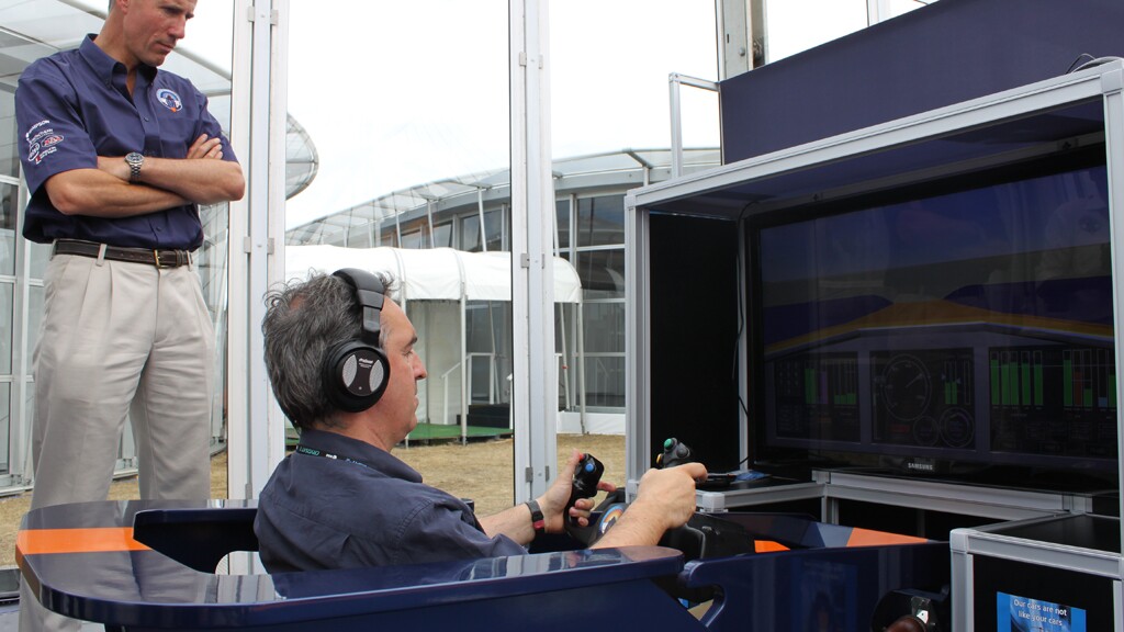 BBC Science Correspondent Jonathan Amos tries the BLOODHOUND Driving Expreience under the watchful eye of Andy Green (Image: Nick Haselwood)