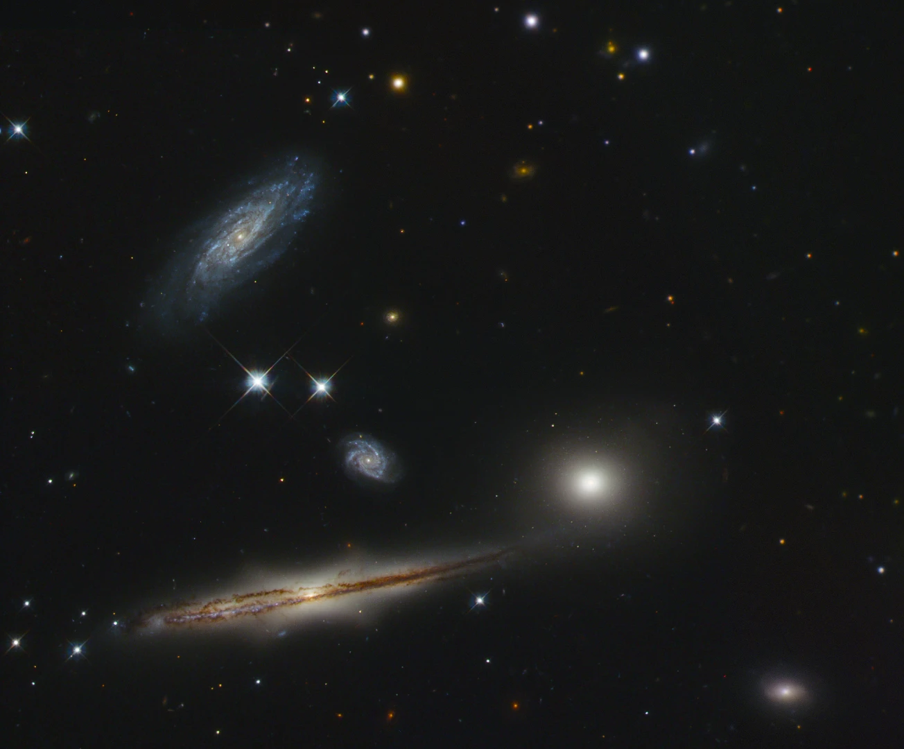 A group of galaxies known as Hickson Compact Group 87 (HCG 87) in near-infrared and visible light.
