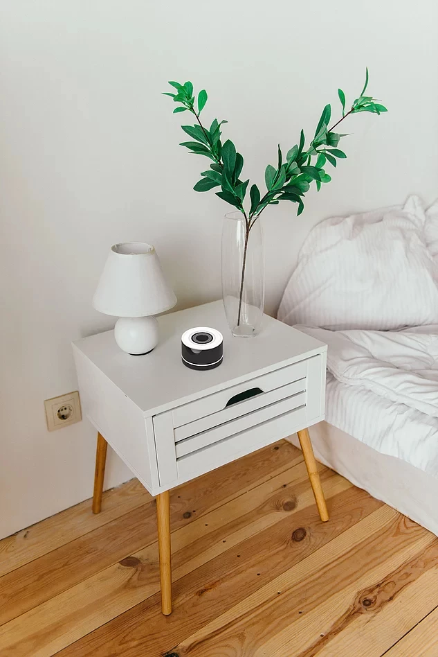 Afflo is charged in an neat compartment that can sit on a bedside table