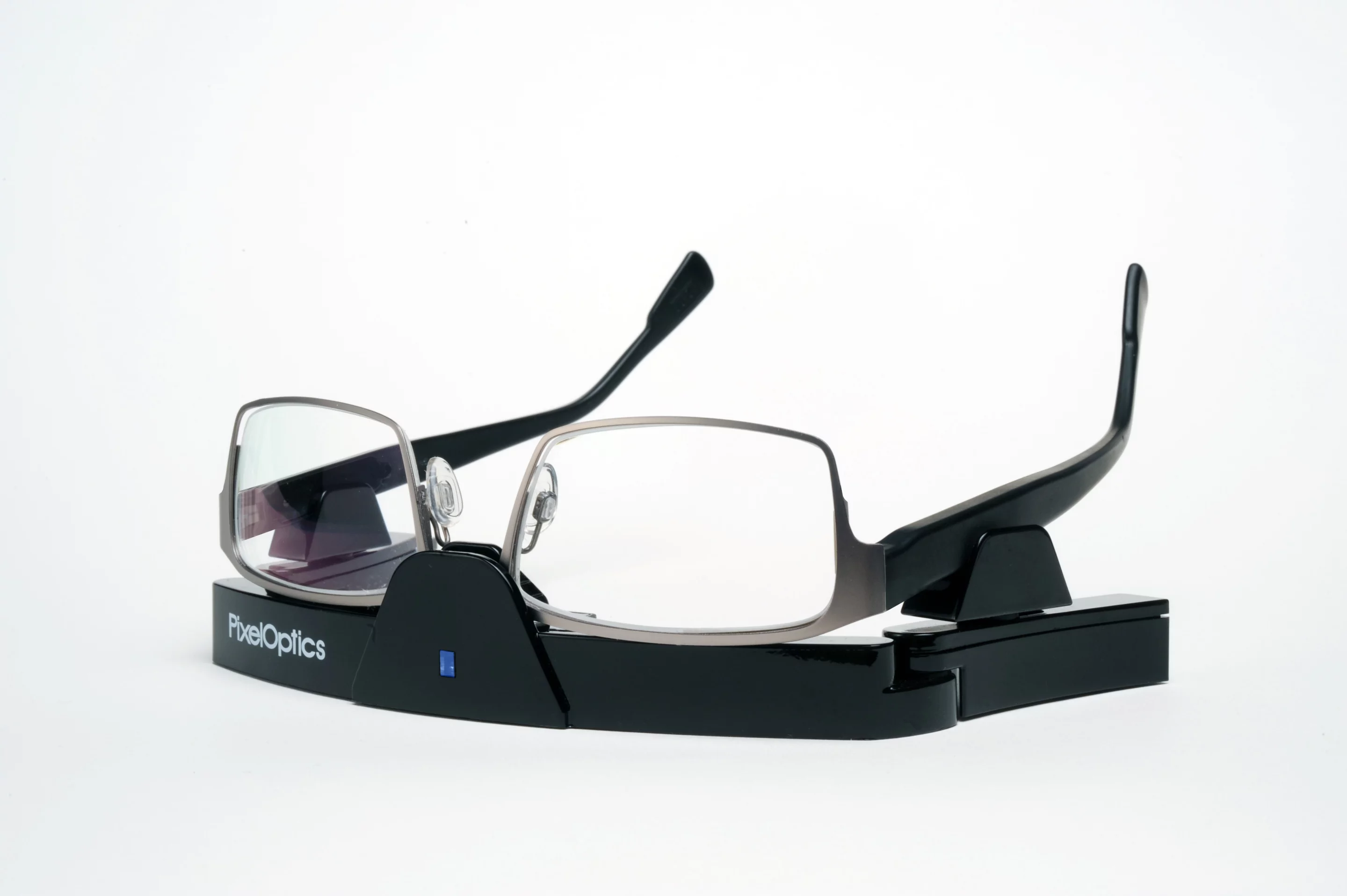 PixelOptics' emPower! electronic focusing glasses, in their charging stand