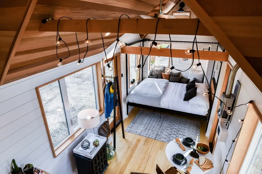 The Urban Payette with Elevator Bed includes a small dining area