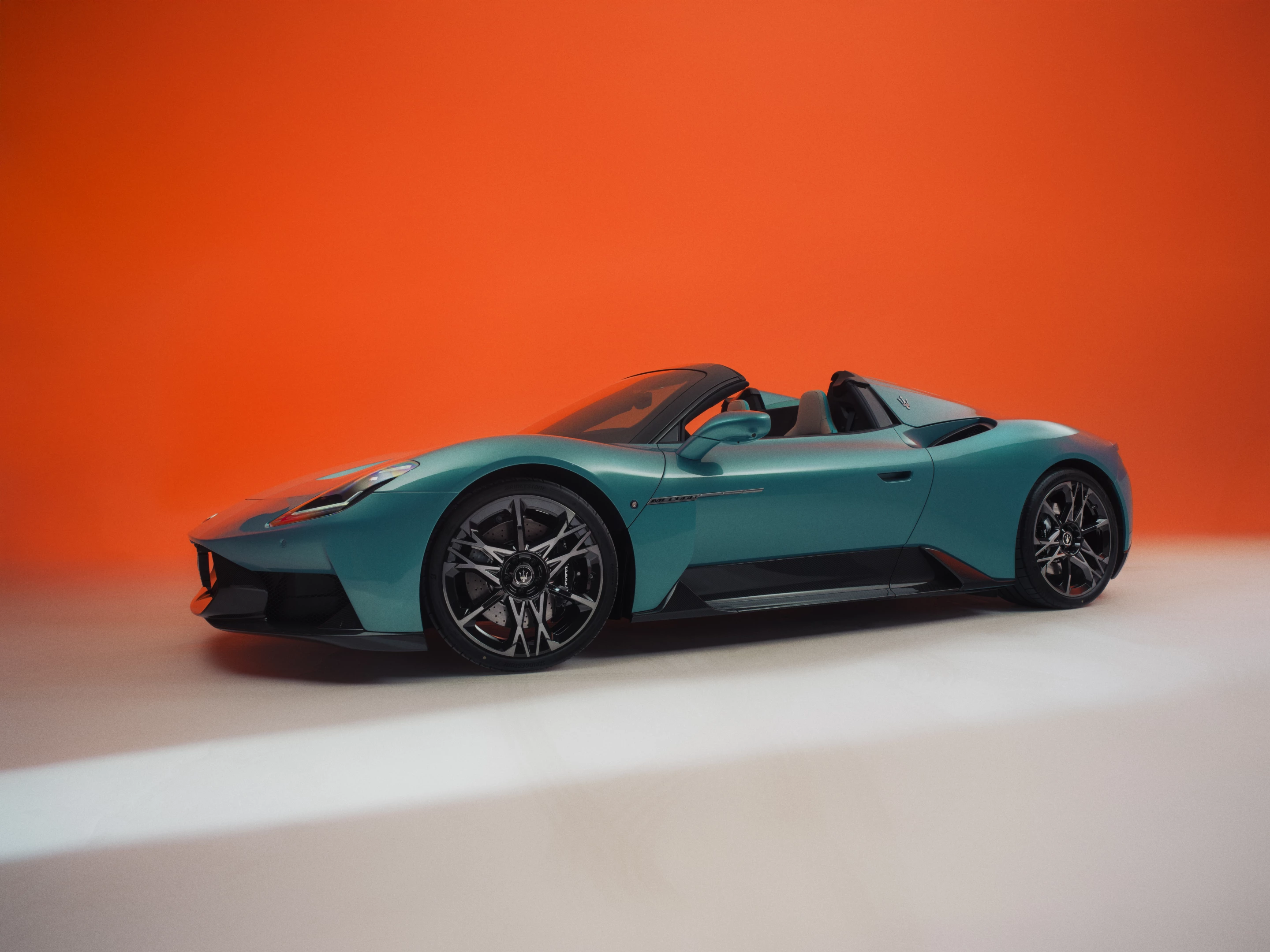 The convertible's roof quickly disappears for open air driving in the MCPura Cielo