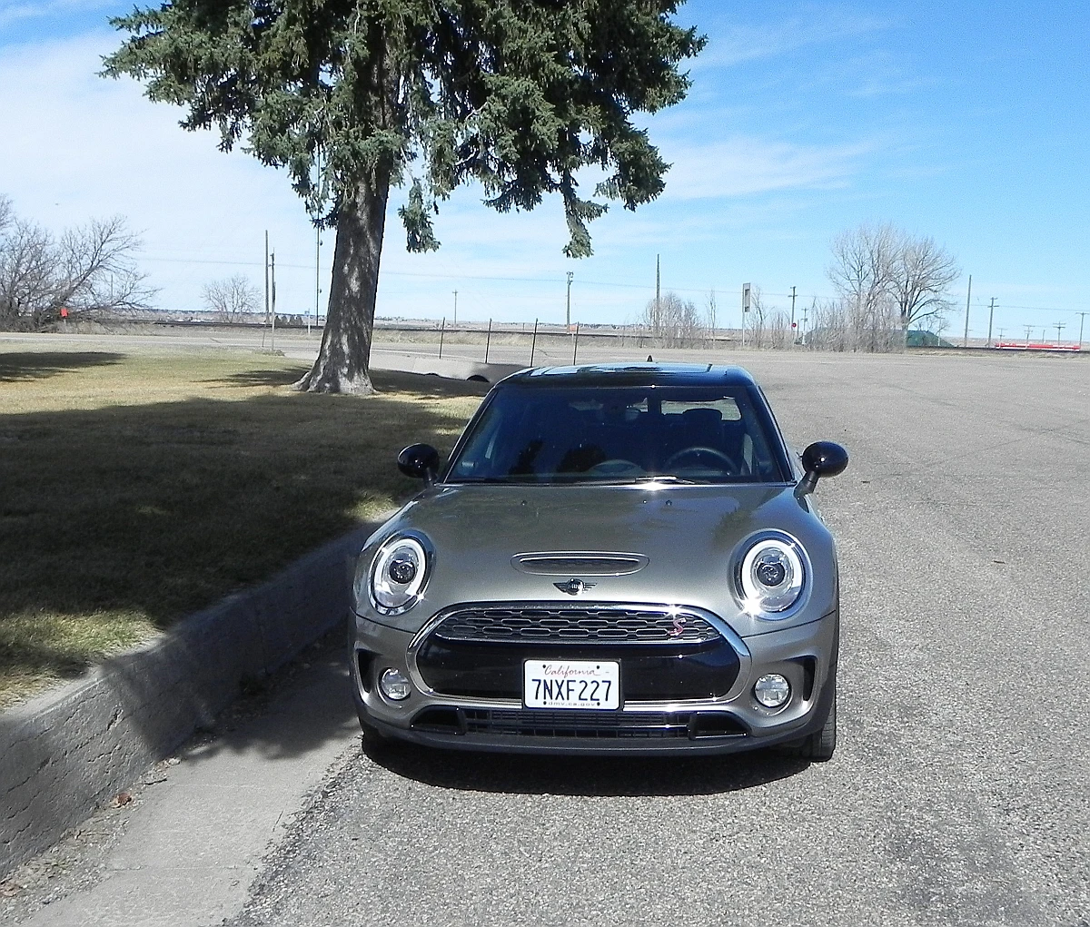 The bulbous headlamps, rounded front fascia, and low roofline are all Mini traits