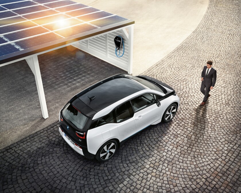 The BMW i3 being charged up using the new wallbox