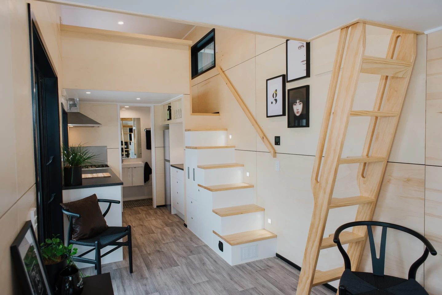 The Kingfisher Tiny House's secondary bedroom is accessed by removable ladder
