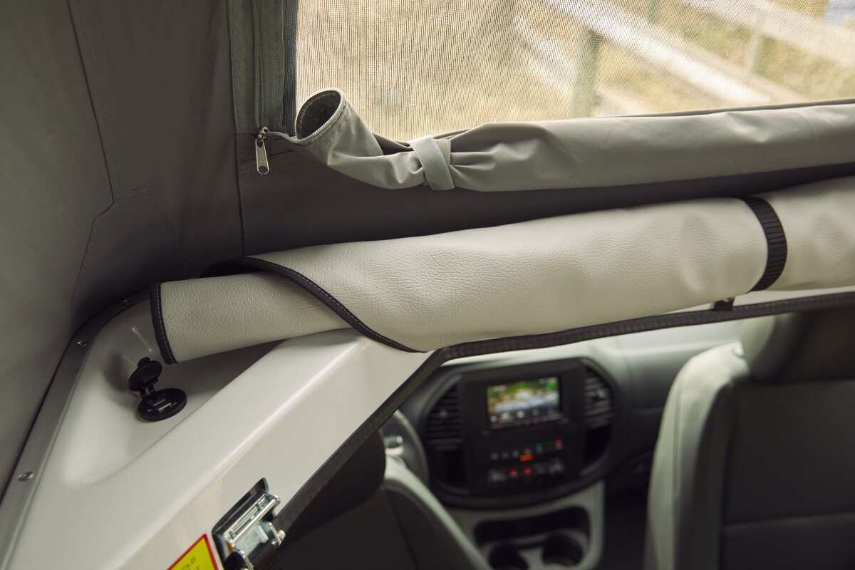 The standard-issue sleeper roof includes a spring-supported foam mattress, three windows and USB charging