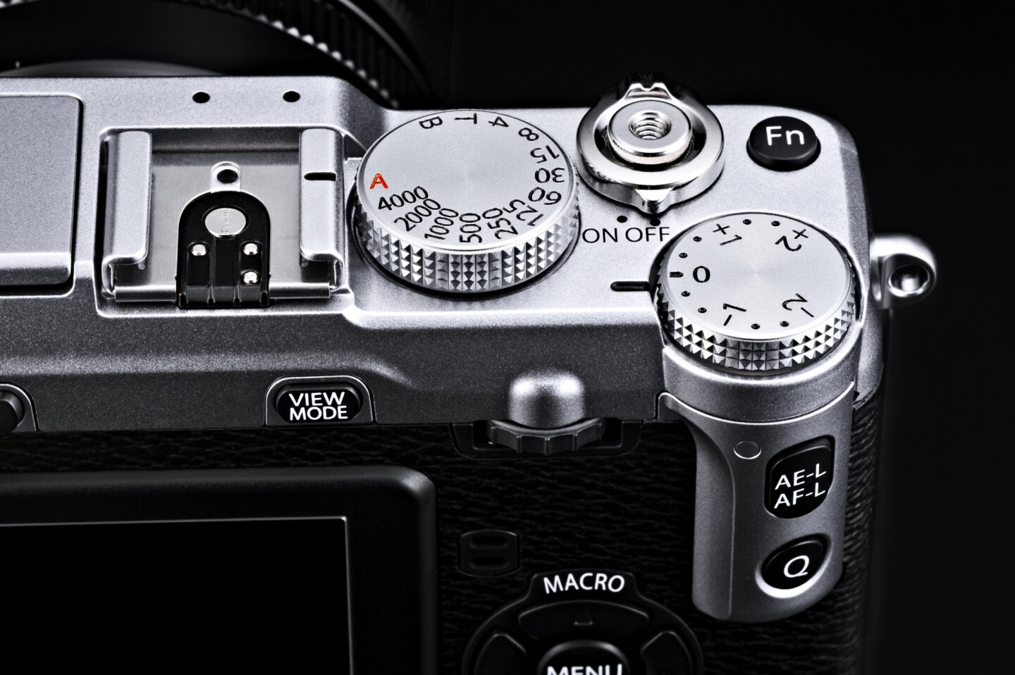 Manual control dials for shutter speed and exposure feature on the top panel of the Fujifilm X-E1 along with a Fn (Function) button