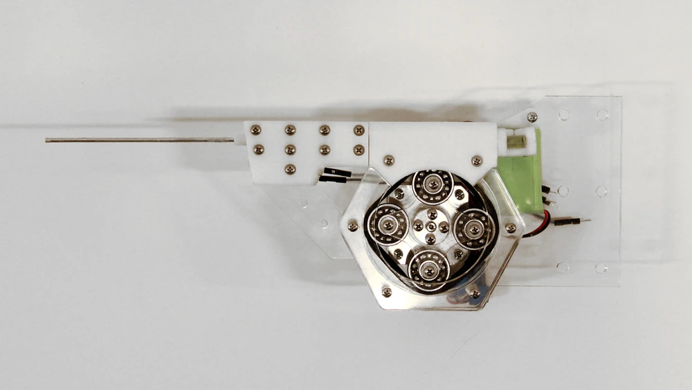 A peristaltic pump mounted on the 6-axes robot, which extrudes a light-cured liquid resin