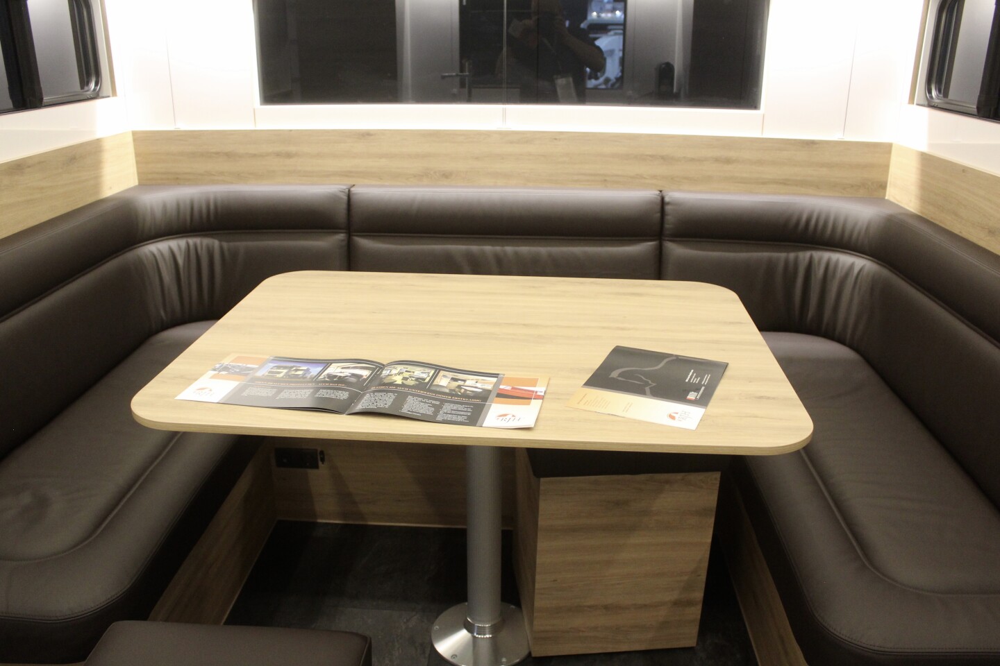 The dining lounge with U-shaped sofa is set in the slide-out