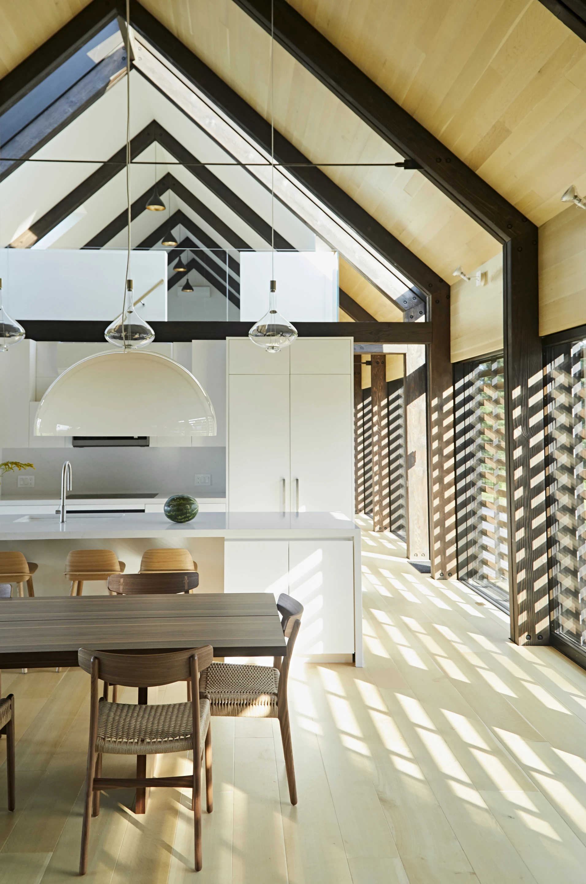 A newly finished dwelling in upstate New York takes careful cues from traditional farm buildings of the area, but makes every effort to afford it inhabitants the comfort of a modern home