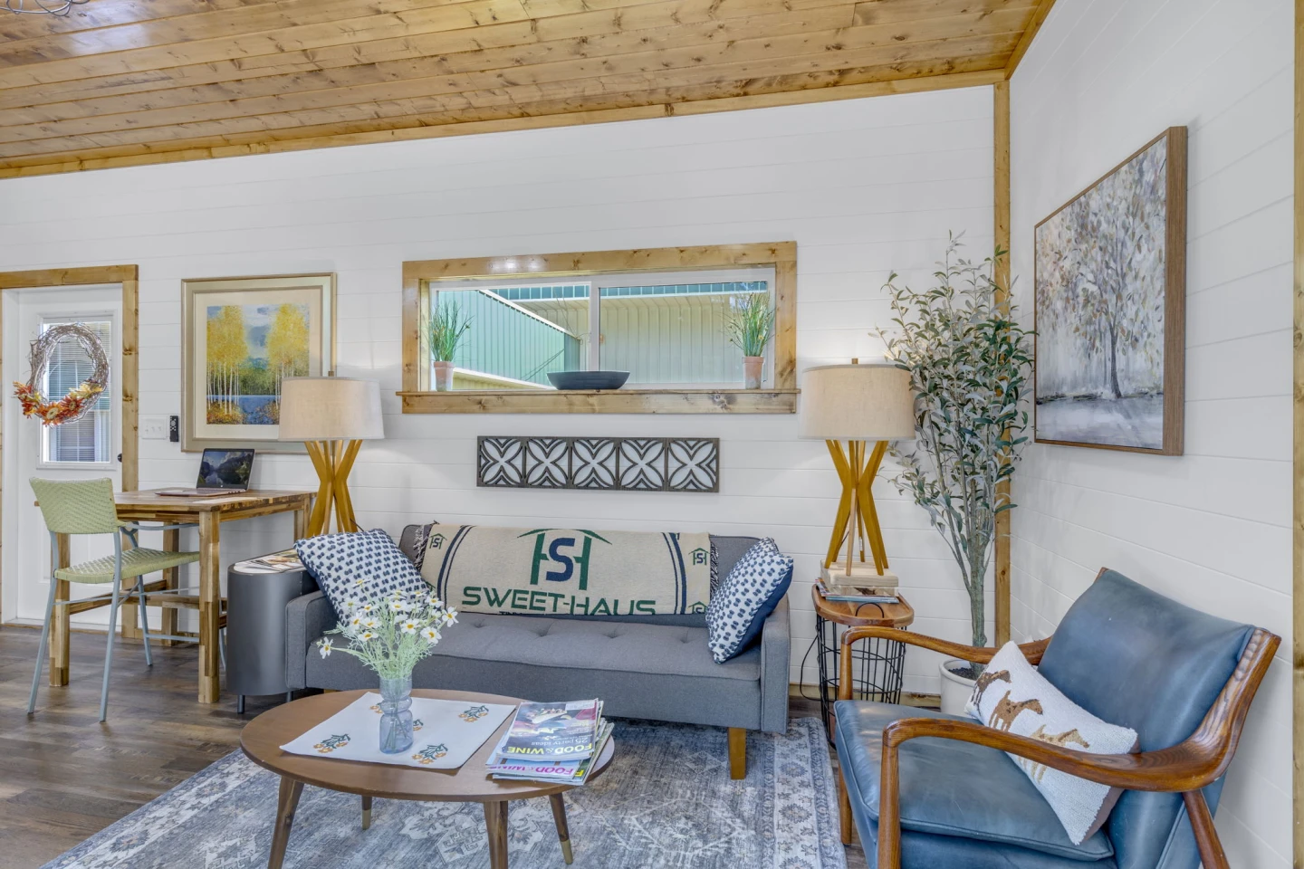 The Acadia's living room includes a sofa, a chair, and a coffee table
