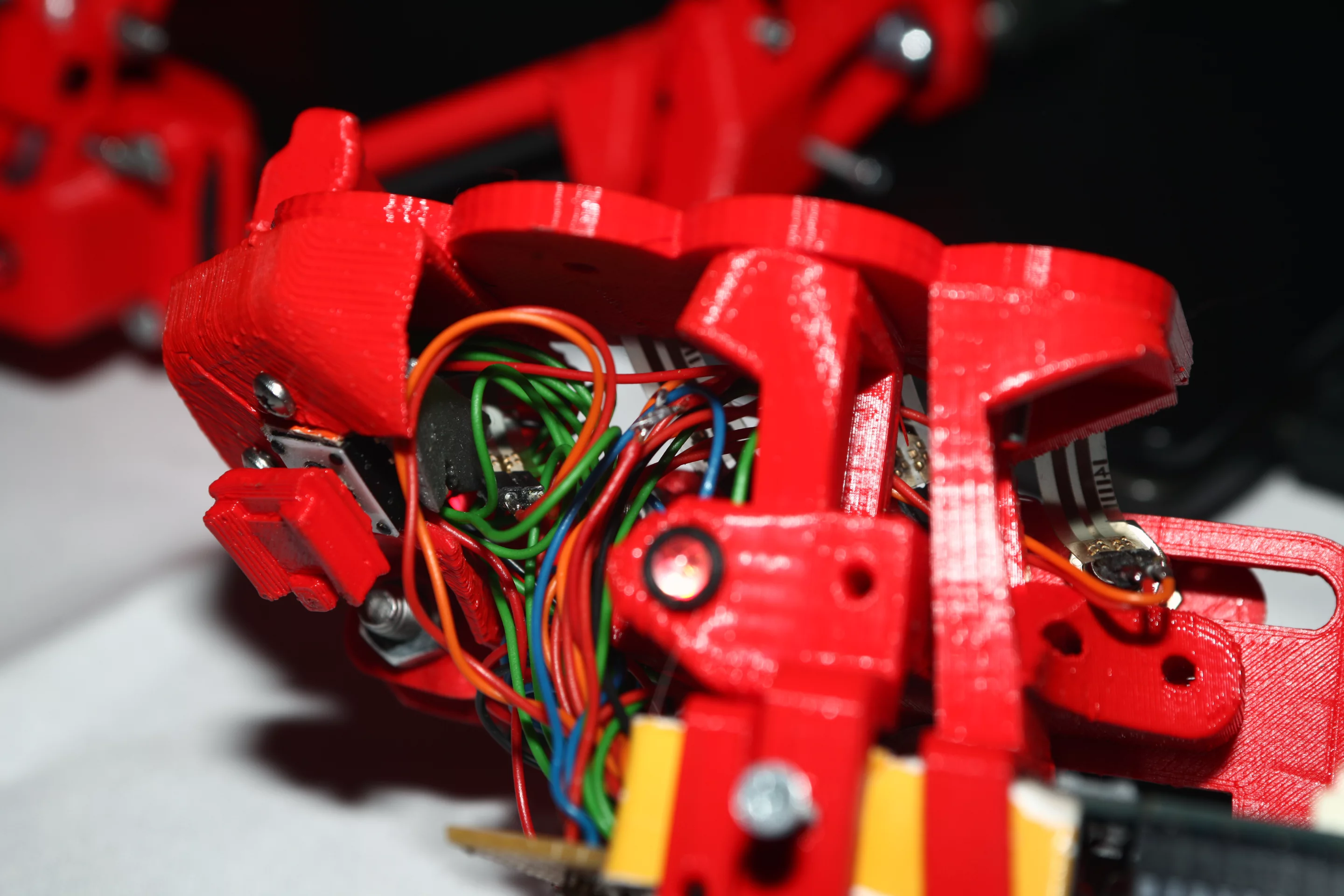 Close up of a red Beatjazz hand controller after the circuitry has been mounted