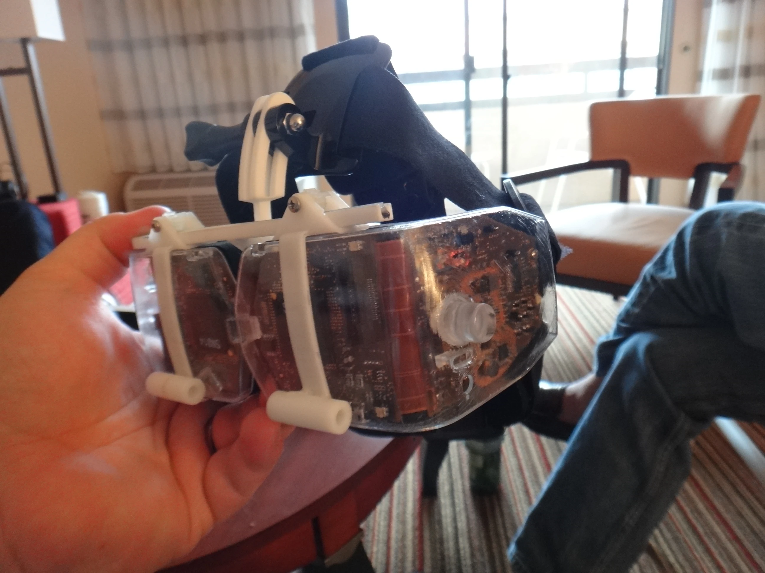 The team originally started out with a proof-of-concept prototype that was about the size of a tabletop, but were able to shrink it down in less than a year to a retinal display fitted into a simple set of glasses