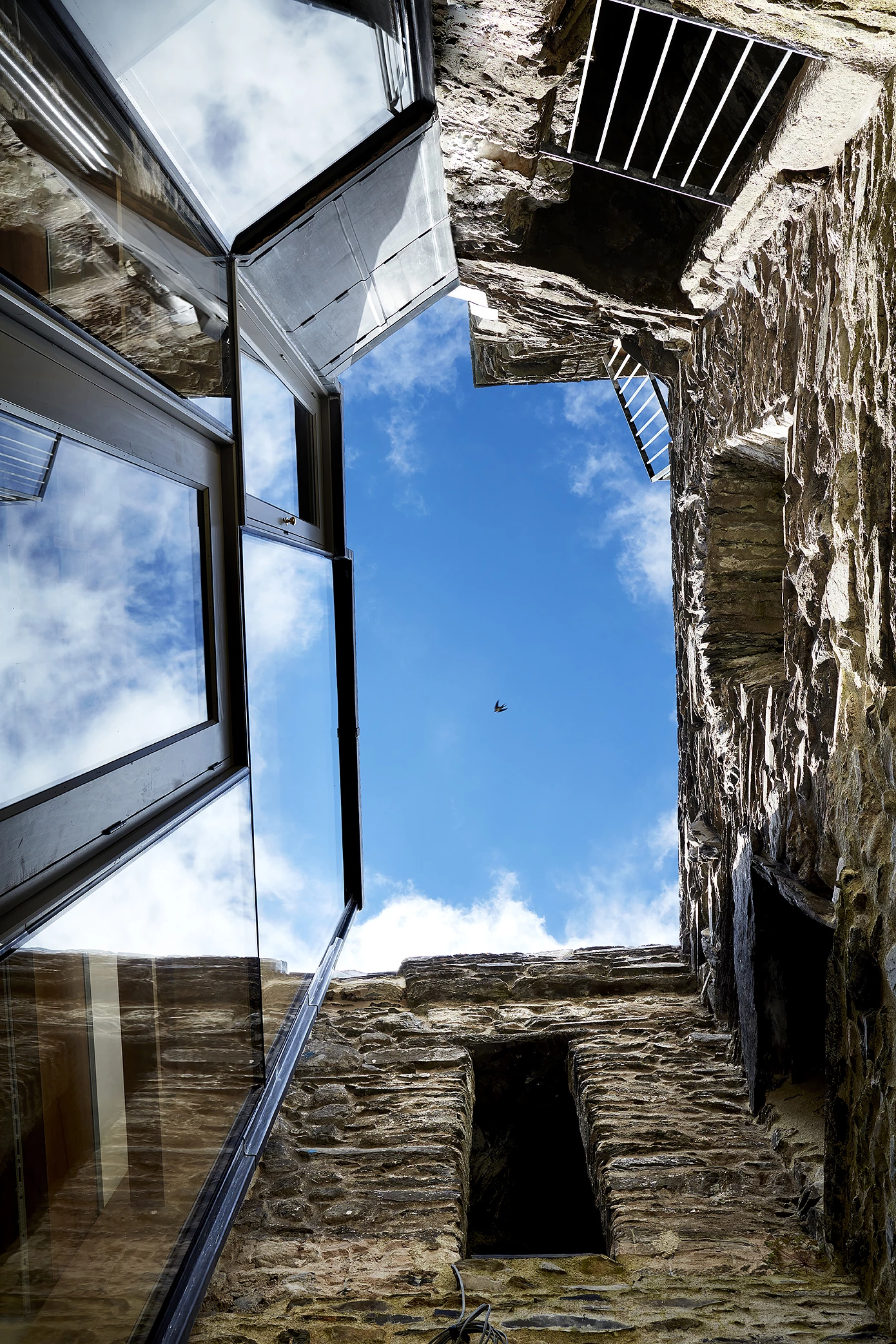 Pele Tower House was designed by Woollacott Gilmartin Architects and is located in Cumbria. The firm turned a decaying group of historic buildings into a 21st century family home