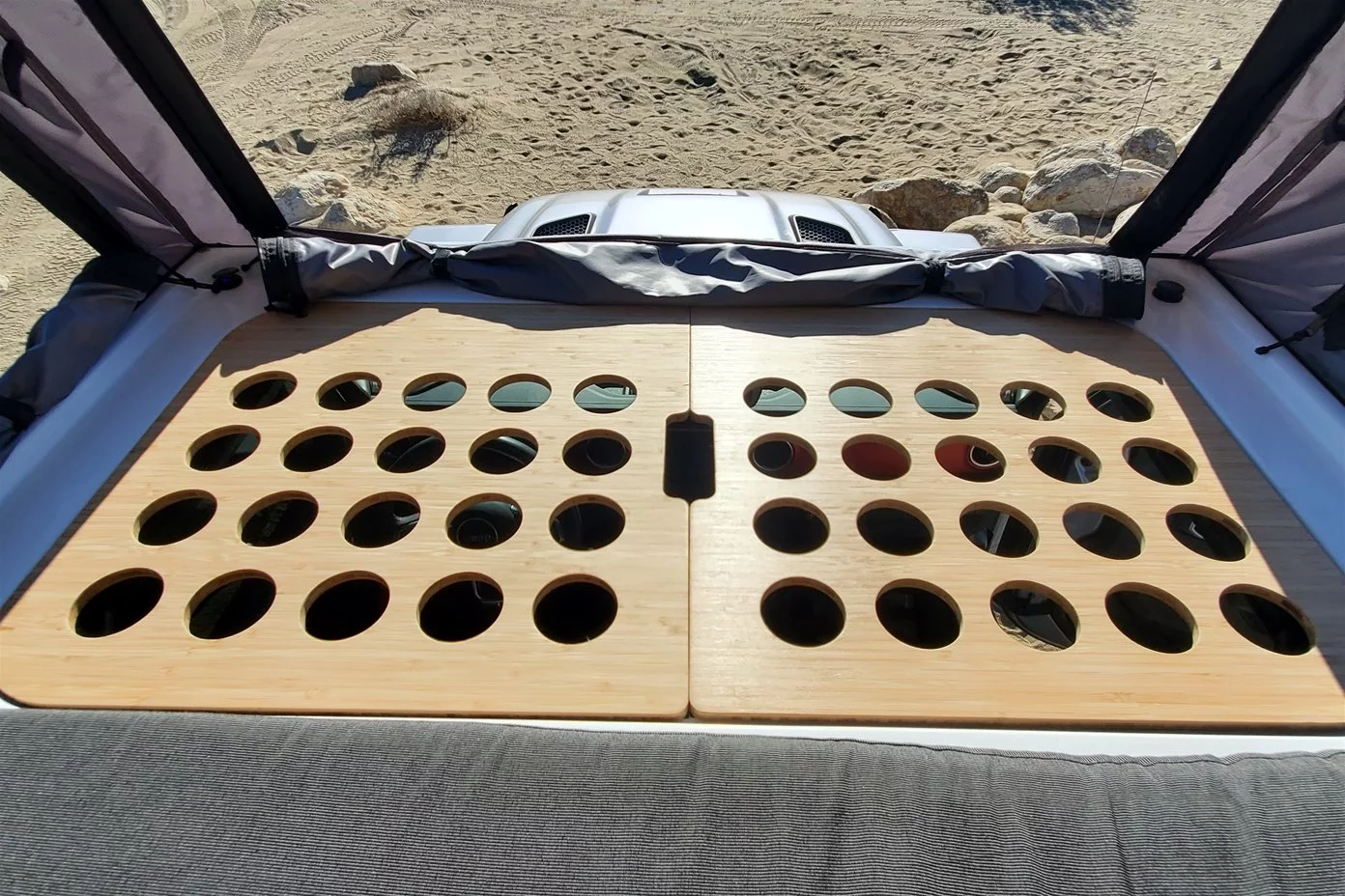 These two panels remove for access between the pop-up roof and driver's cab, then fit together to complete the bed surface