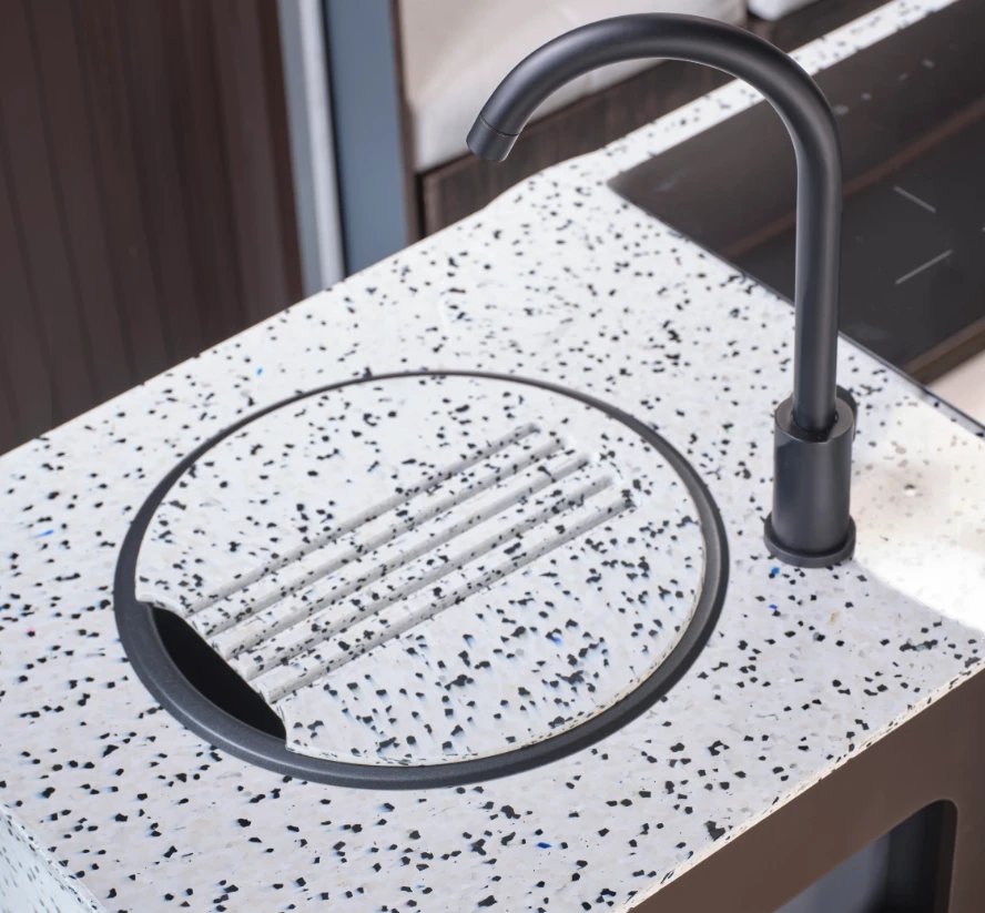 The speckled worktops are made from recycled kitchen appliances, further decreasing the Endeavor EV concept's carbon footprint