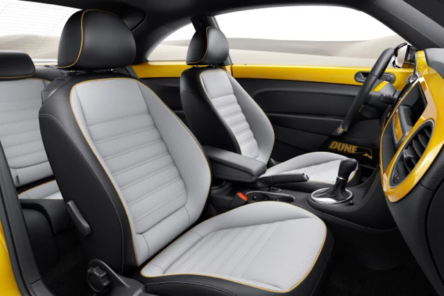 The interior features black leather and Gobi sport fabric upholstery, aluminum dash accents, and a high-resolution 7.7-inch AMOLED touchscreen