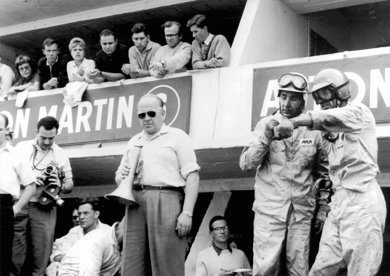Roy Salvadori and Carroll Shelby await a pit stop during the 1959 Le Mans 24 hour race