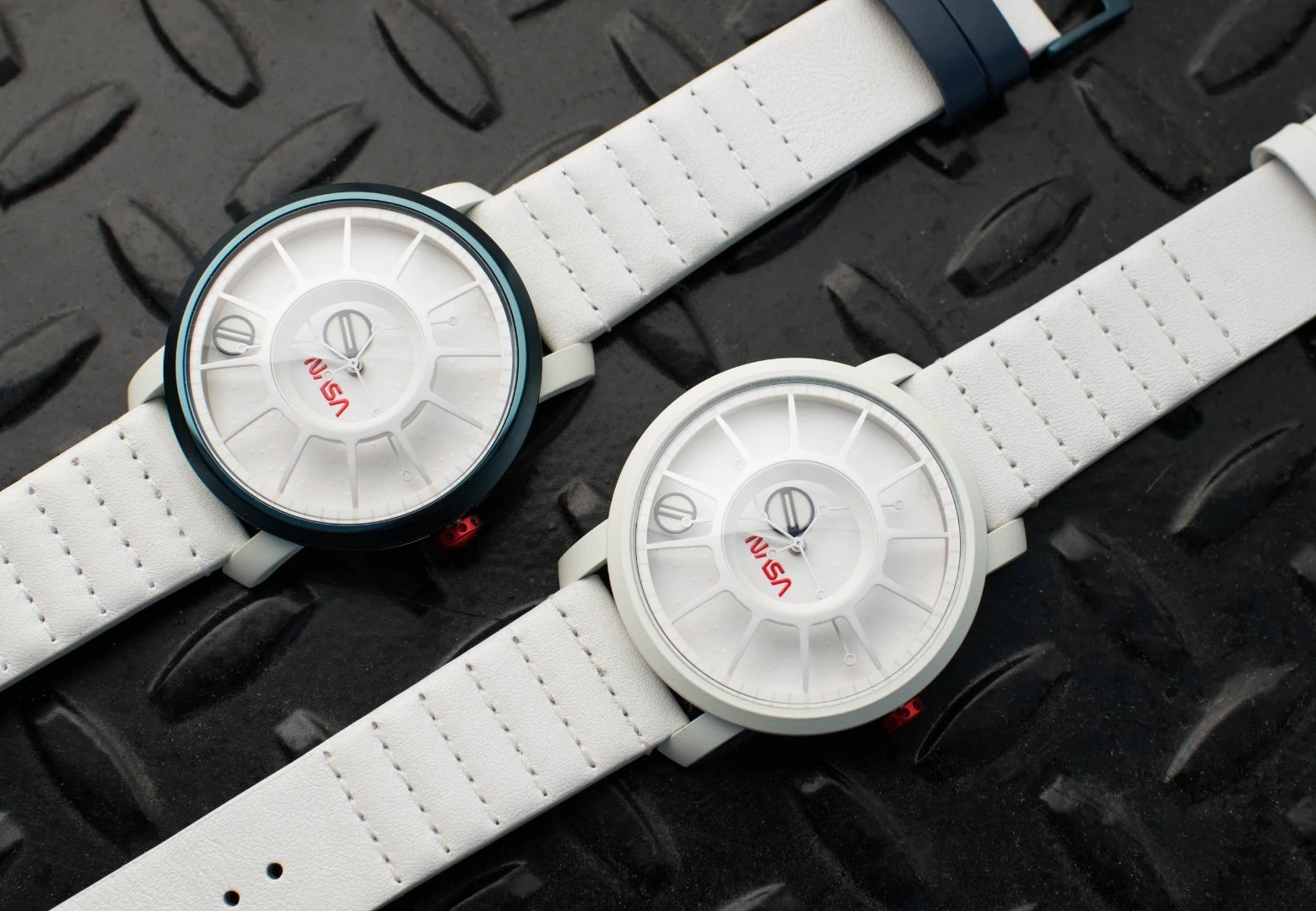 The Saturn V (left) and Apollo 11 (right) models,both feature unique Cerakote treatment usually used in the firearm industry (automatic movement versions shown)