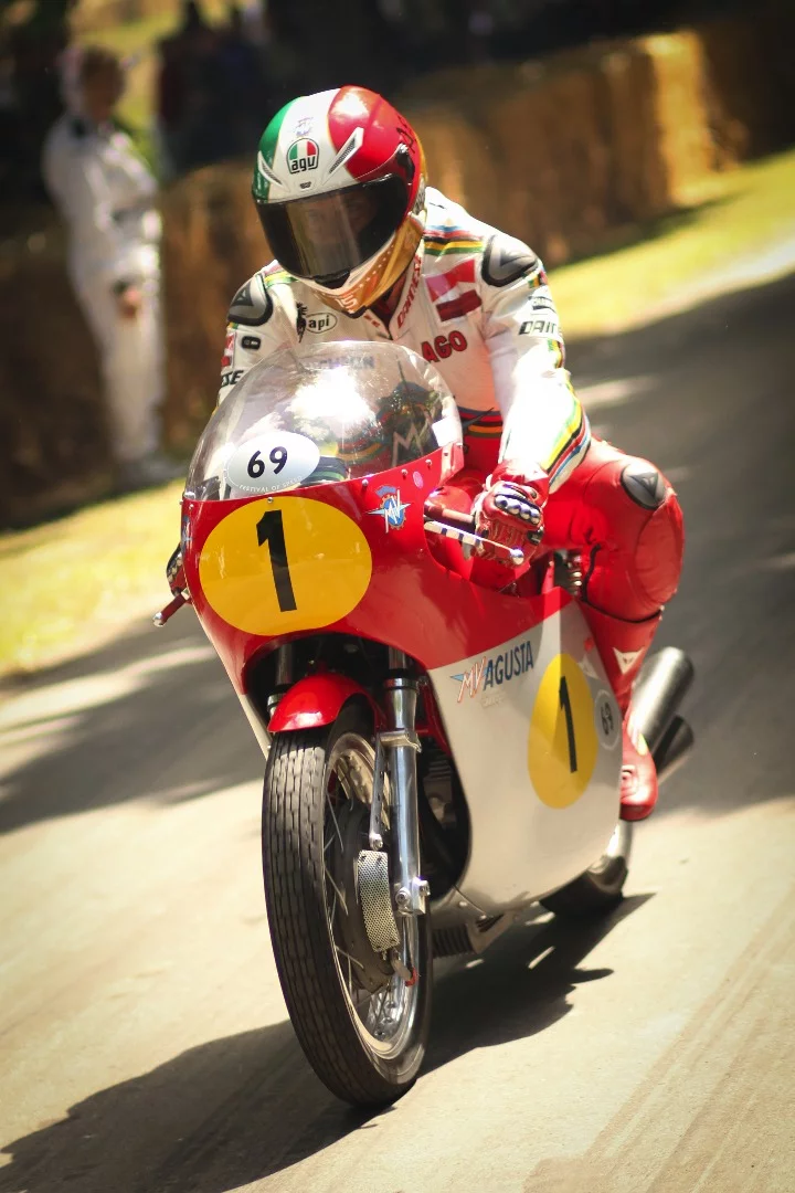 If you don't know who this is, you probably won't care. It's Giacomo Agostini on his MV Agusta. Between the bike and the rider, they were unbeatable. In 1968, Agostini won ten races in a row because there were only ten races. In 1969 he won ten races in a row then didn't attend the final two races (a sporting gesture), then did the same in 1970. In 1971 he won the first eight races then decided to give the Ulster GP a miss on safety grounds, then had a DNF in the following GP. That is, he won 38 consecutive GPs he contested, which MV Agusta it was we don't know and it probably doesn't matter much because they all won nearly every race they contested