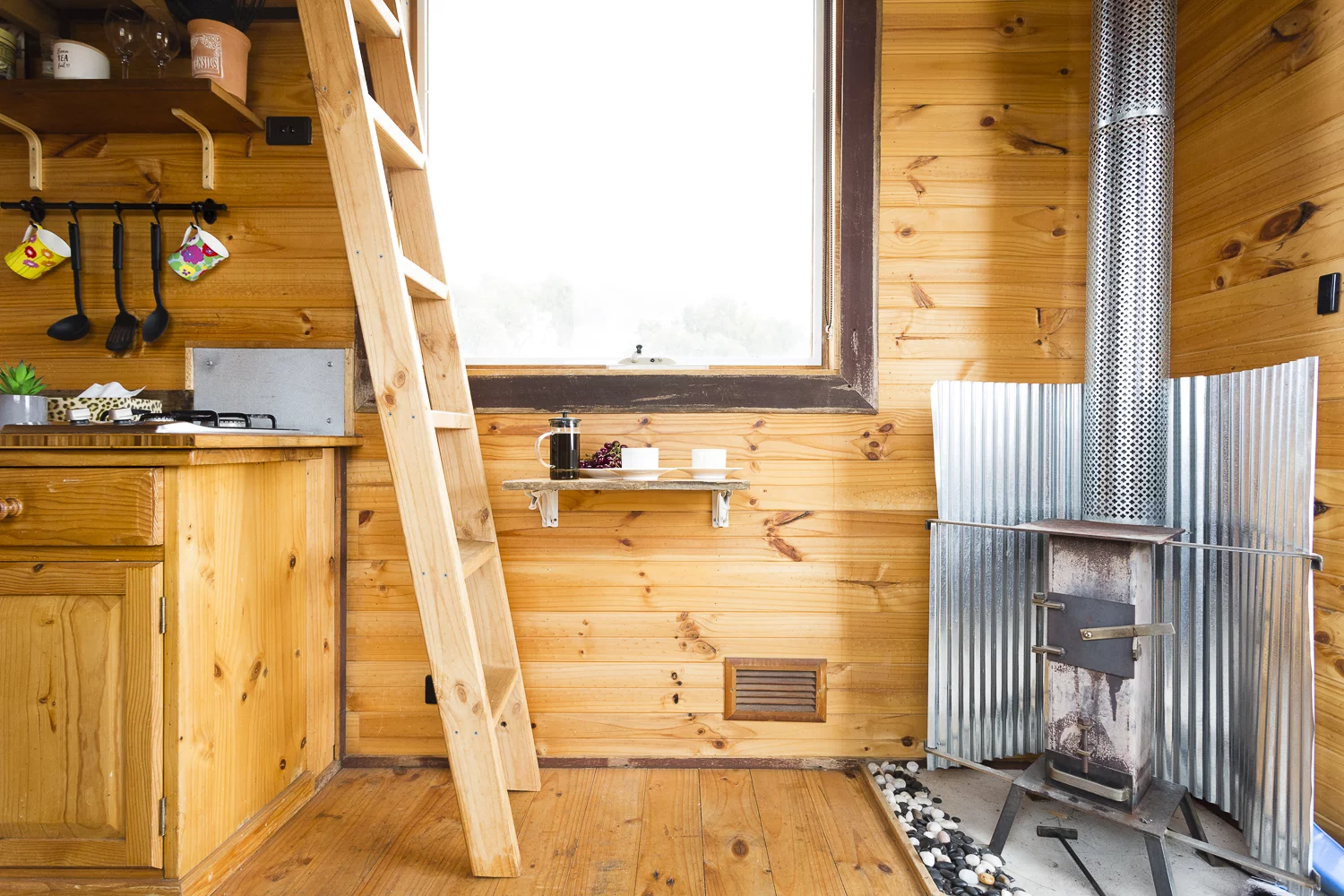 The Tallarook Hilltop Tiny House 1's interior is cabin-like and comfortable