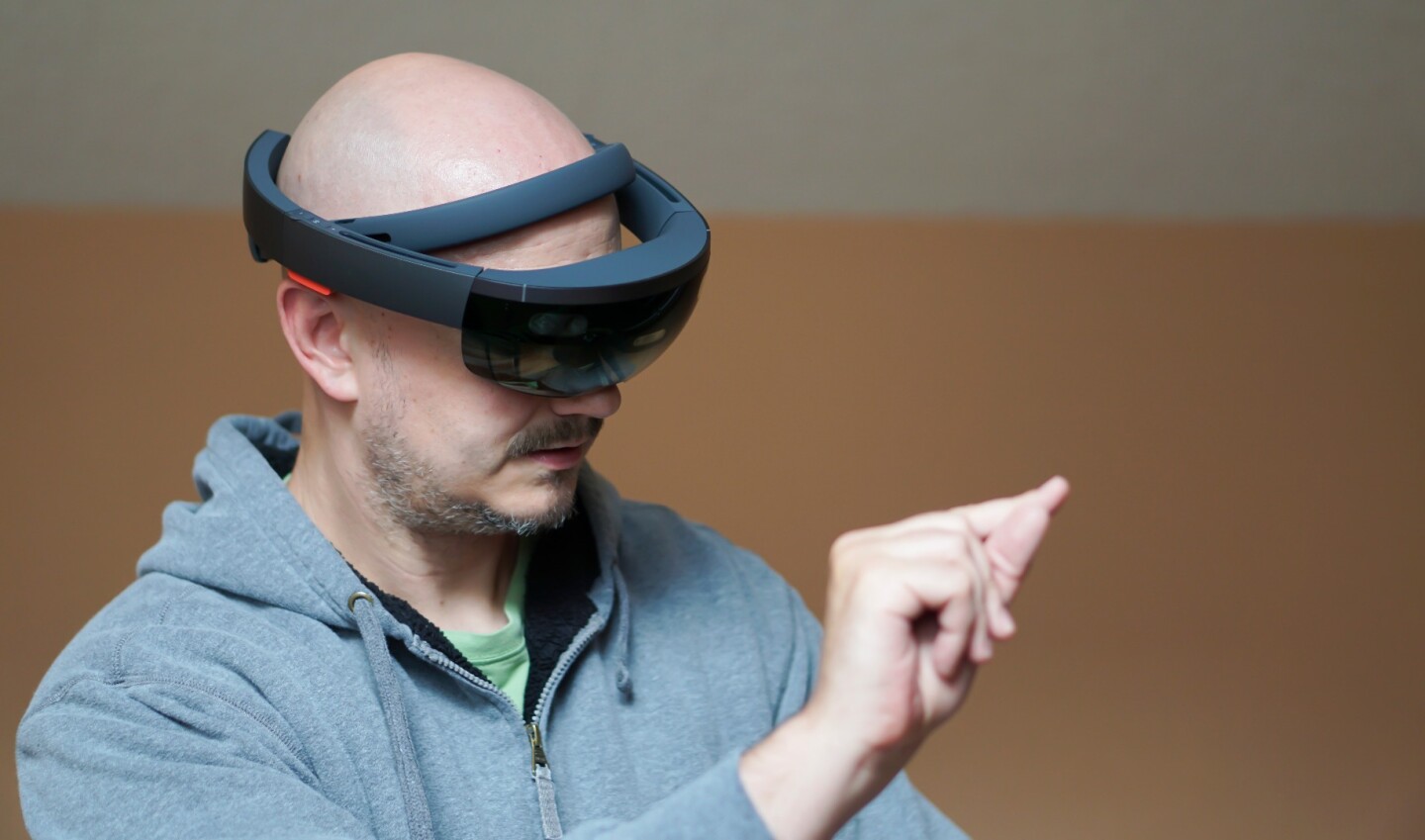HoloLens already detects in-air hand gestures, though its accuracy isn't quite to the pinpoint, seamless level