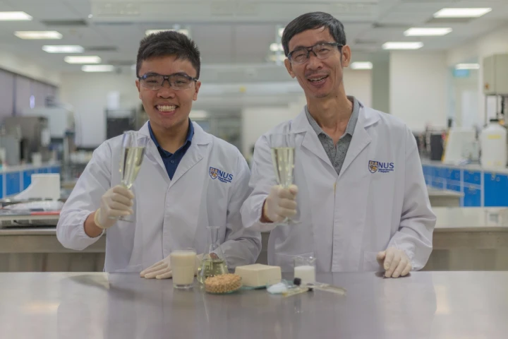 Associate Professor Liu Shao Quan (right) and PhD student Mr. Chua Jian Yong (left) with glasses of Sachi