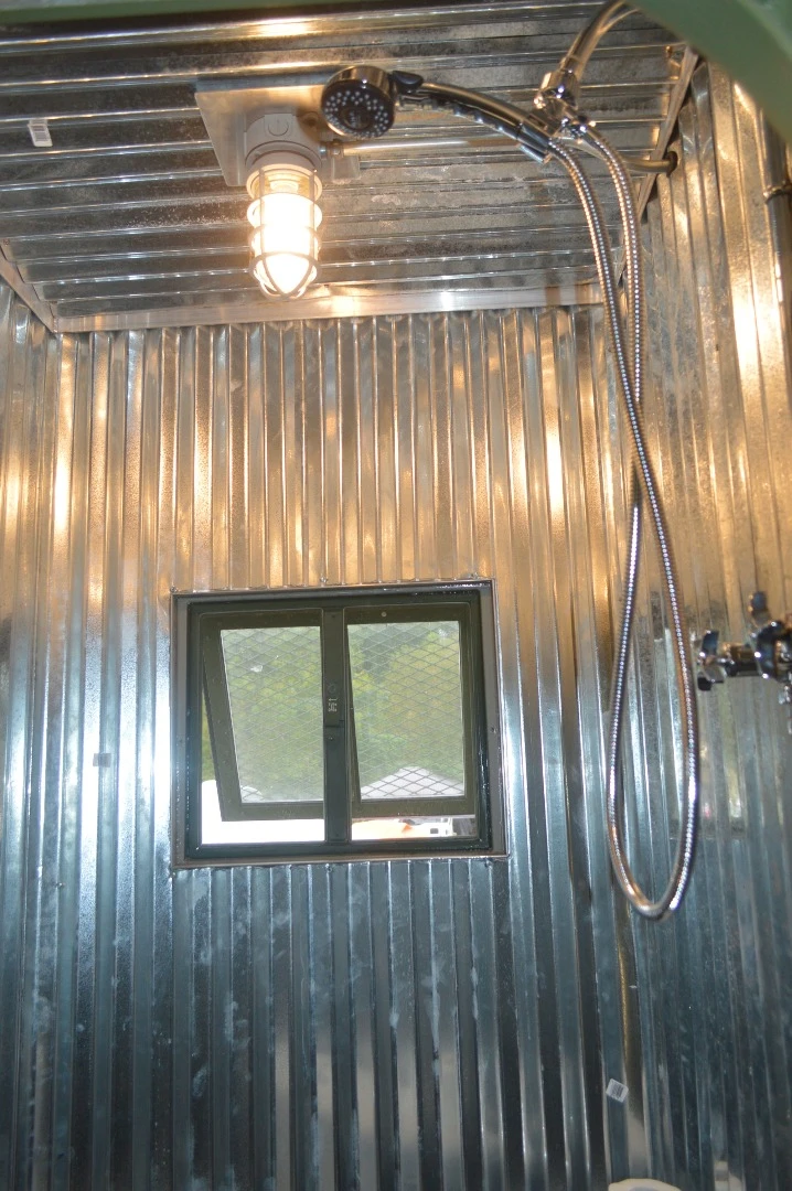 The Bravo 1's wet bath includes galvanized wall panels and a shower