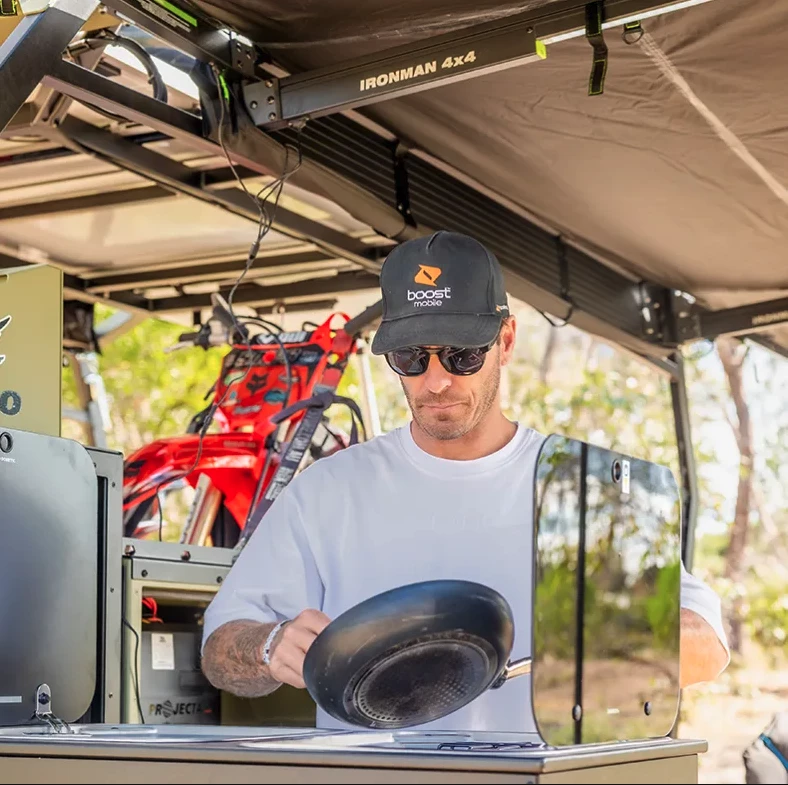 Camping options include a rooftop tent, slide-out kitchen, slide-out fridge, power and water