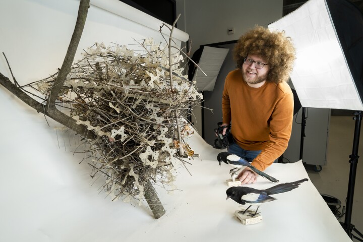 Biologist Auke-Florian Hiemstra with the spiky magpie nest that prompted the study