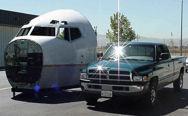 A movable base is attached to the bottom of the 737 cockpit