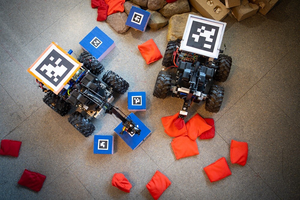 The bridge-building robot is said to take cues from its surrounding, picking up bean bags to fill in the gaps in the rubble until it can more easily move over the rocks, bricks and broken concrete to reach its goal