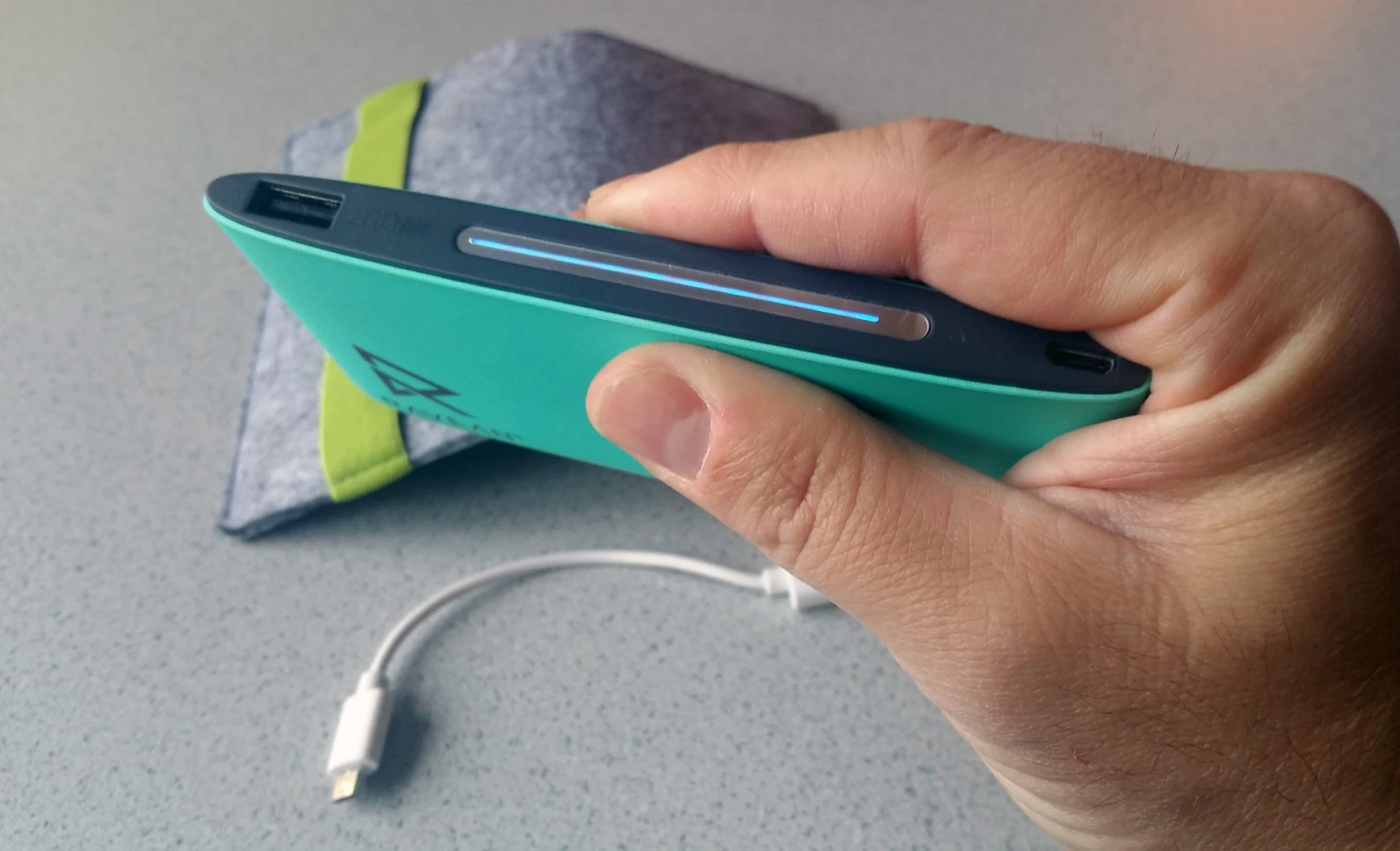 Included with each Ravean heated vest or hoodie is a slim 5,000 mAh power bank, micro USB cable, and felt case