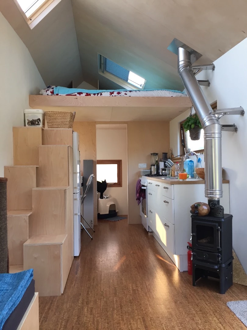 Stairs with integrated storage lead to the sleeping area