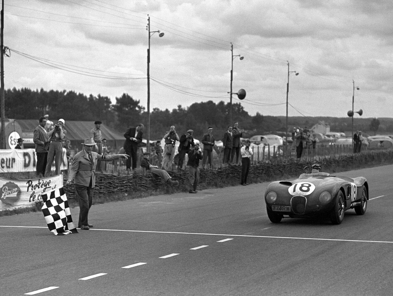 Jaguar C-type number 18 driven by Tony Rolt and Duncan Hamilton wins the 1953 Le Mans 24 Hours