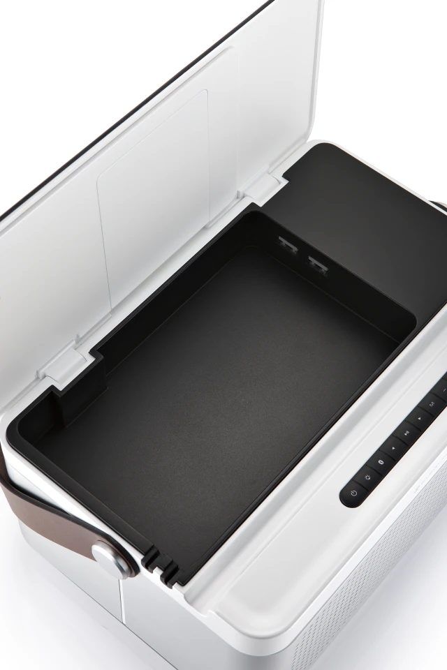 There's a lid up top which opens to a utility box for storing charging cables, earphones, thumb drives, house keys or all manner of modern life's necessities