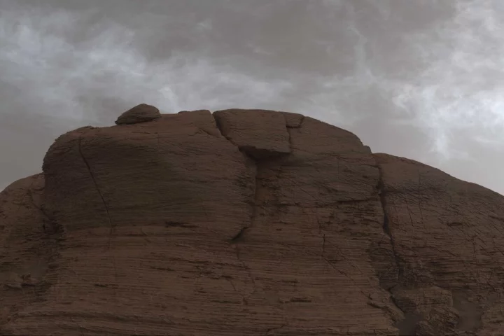 Image made from 21 individual images stitched together and color corrected, shows clouds just after sunset on Mars