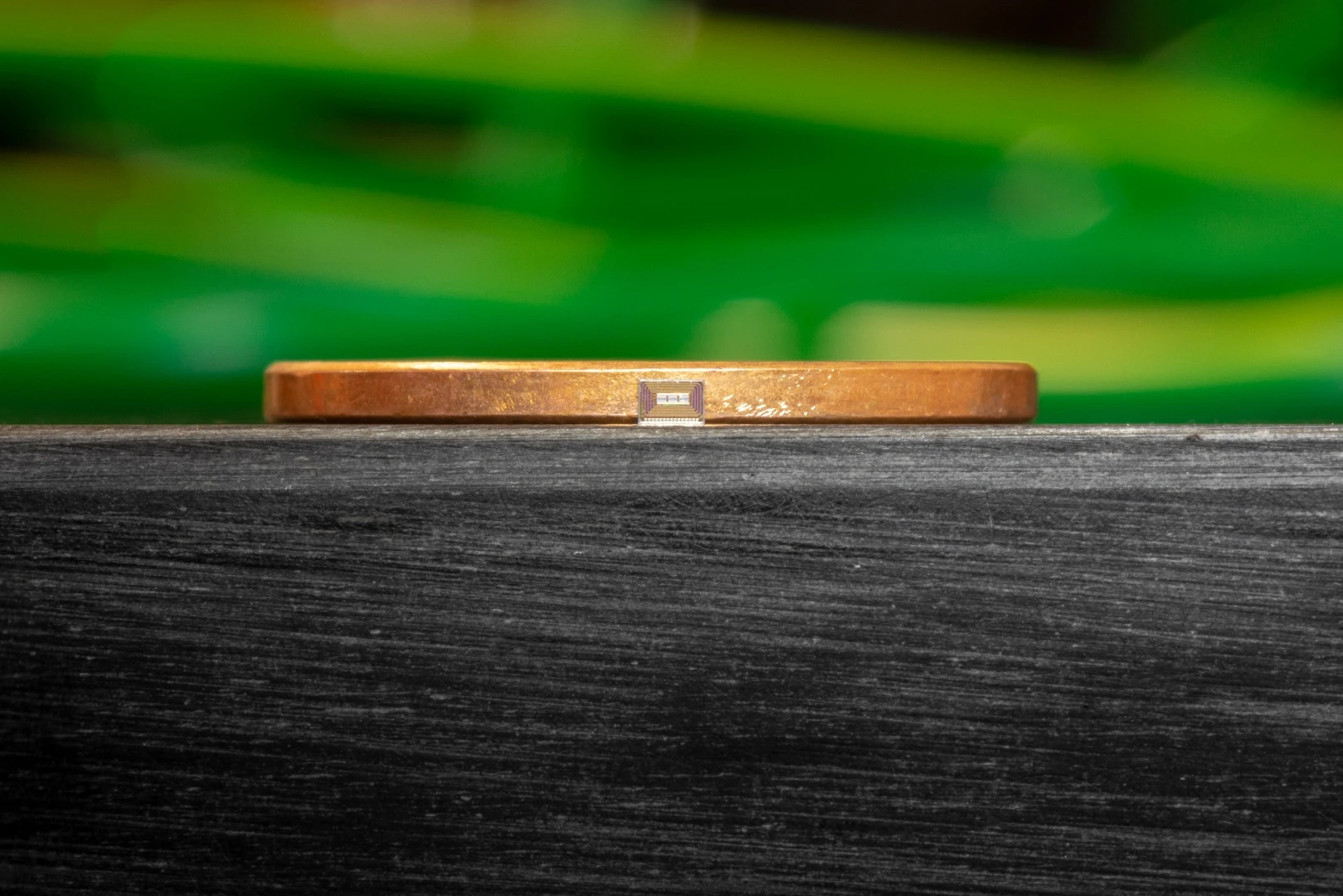 The size of the chip as compared to the thickness of a penny
