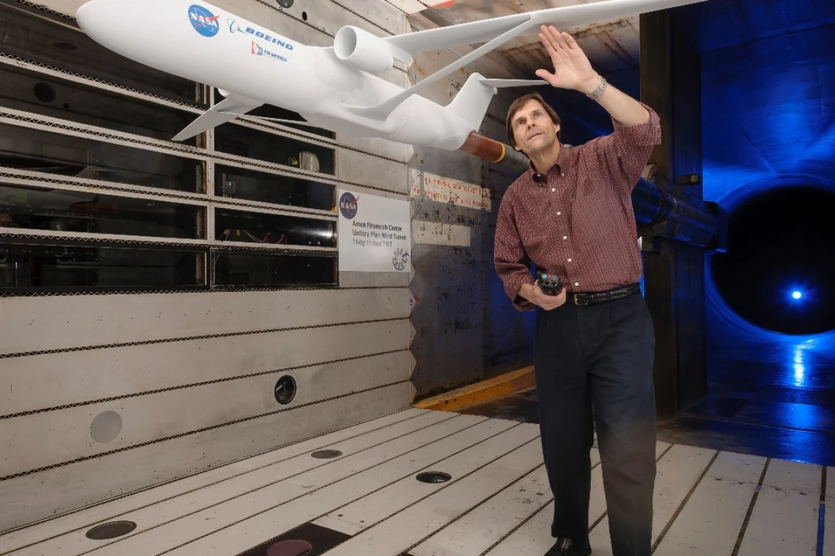 Greg Gatlin, NASA aerospace research engineer, inspects the truss-braced wing during testing in the Unitary Plan Wind Tunnel complex at NASA’s Ames Research Center in Silicon Valley