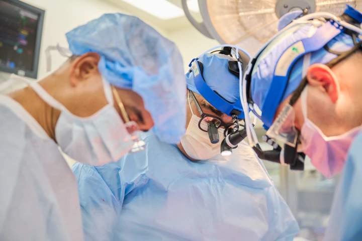 Nader Moazami, (center) surgical director of heart transplantation at the NYU Langone Transplant Institute, leads the team as a genetically modified pig heart is transplanted into a recently deceased donor on July 6, 2022, in New York