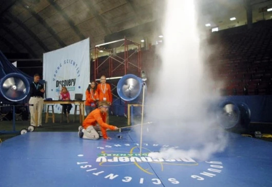 Jacob Perry, 11, of Livingston, MT and his teammates test how tornados and hurricanes form during an exercise in the Eye of the Storm exercise to explore the “Forces of Nature” at Discovery Channel Young Scientist Challenge. Photographer: Robin Weiner