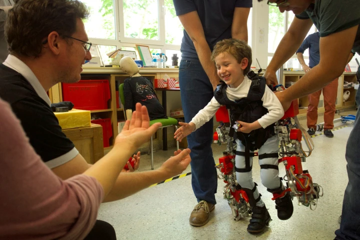 A young user tries out the exoskeleton