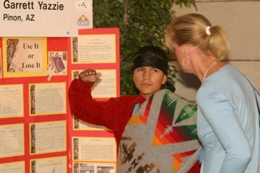 Discovery Channel Young Scientist Challenge Finalist, Garrett Yazzie, 14, of the Navajo Nation in Pinon, Arizona, explains how he built a solar water heater from a 1967 Pontiac radiator at the National Academy of Sciences in Washington, DC on October 16,