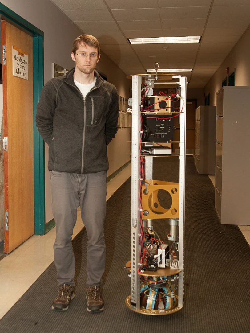 The SIMbot alongside Greg Seyfarth, who recently completed his master's degree in robotics at Carnegie Mellon