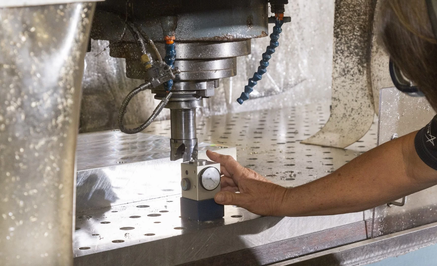 A machinist prepares the milling equipment for the first manufactured part of the aircraft structure for the X-59 QueSST at Lockheed Martin Skunk Works, Palmdale, California