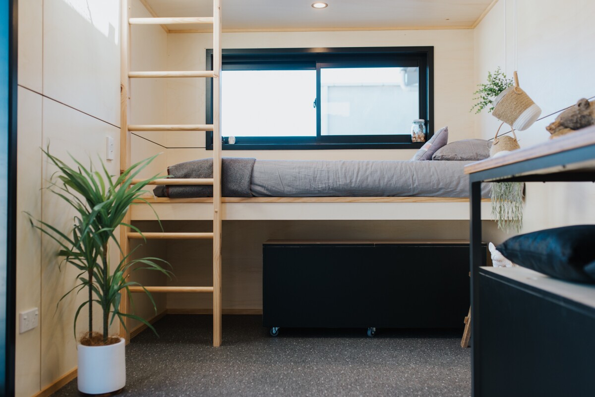 The Tiny Tāwharau includes a bunk bed sleeping area for the family's two young kids